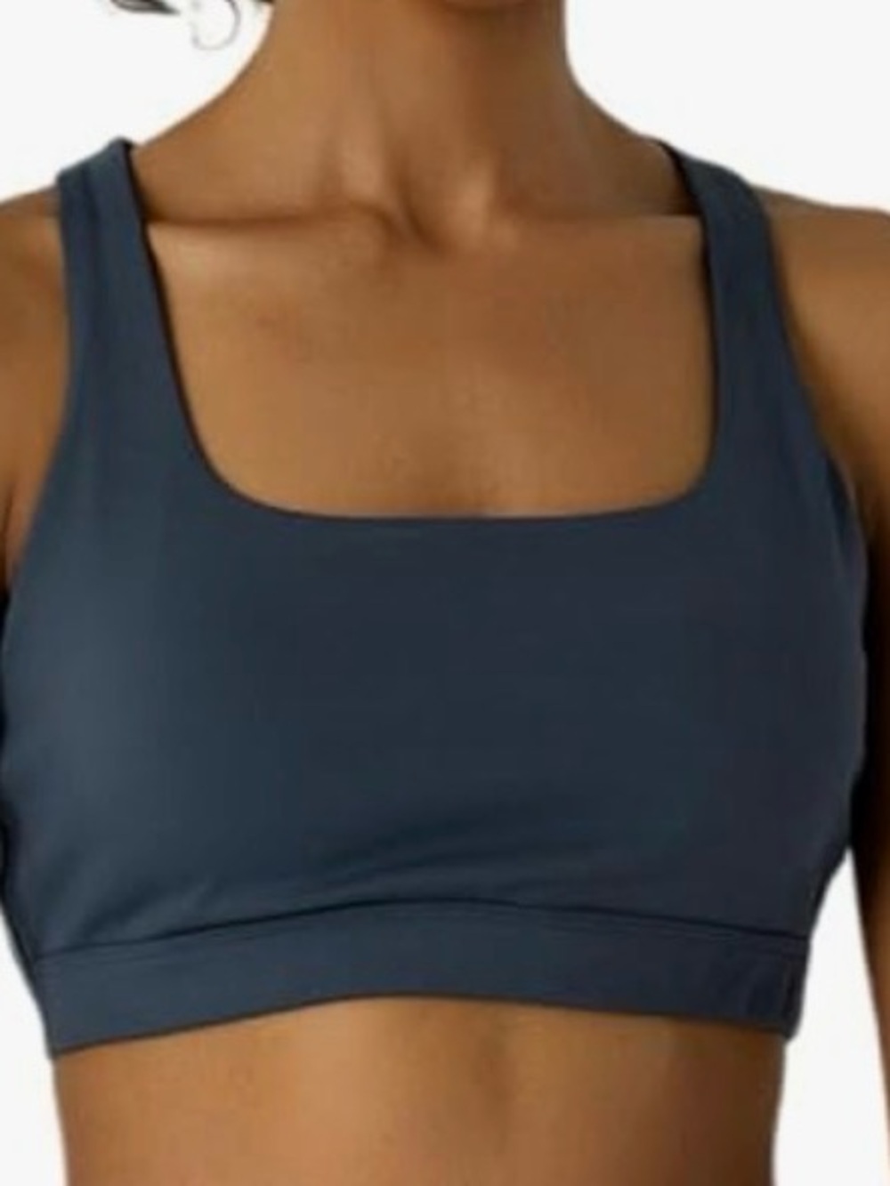 Women’s navy blue sports bra padded with medium support. Crisscross back . NWT